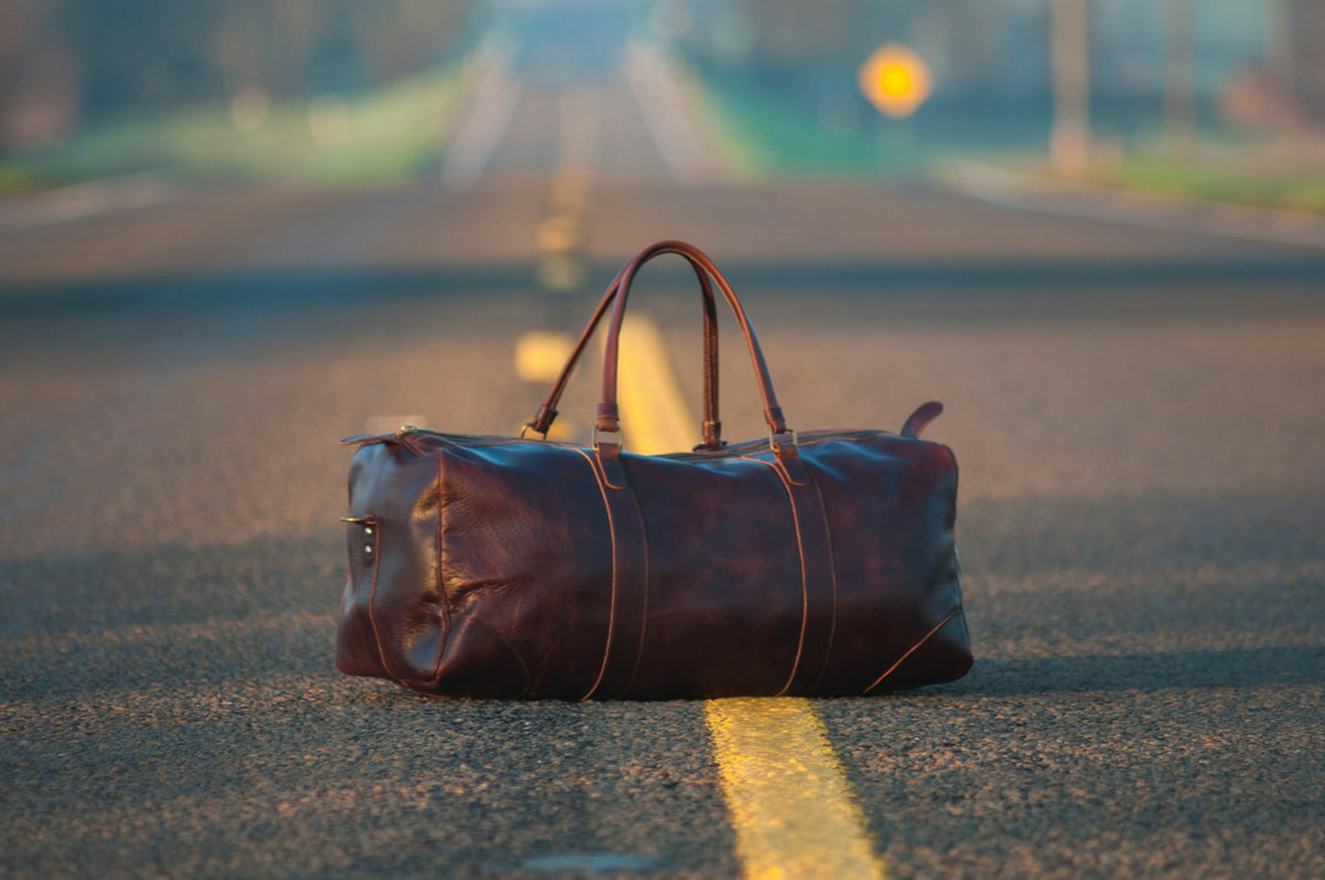 Brown leather weekender duffel bag